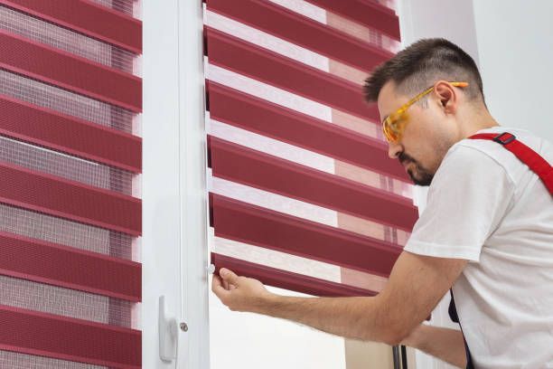 High-contrast venetian window blinds featuring slim slats and a shallow depth of field for a minimalist office aesthetic.