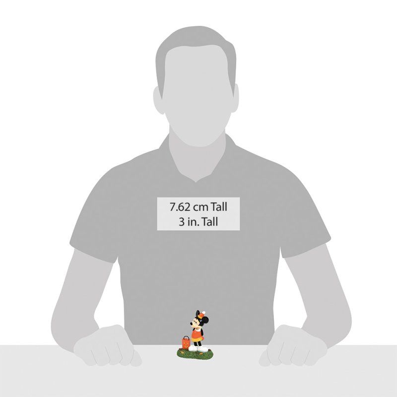 Een klein Minnie Mouse-beeldje op een groene voet. Een silhouet van een persoon geeft de schaal aan.