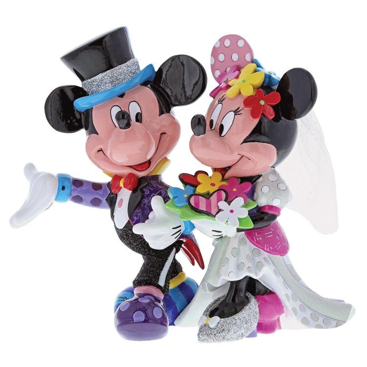 Mickey en Minnie Mouse beeldjes, gekleed voor een bruiloft, hand in hand, met kleurrijke details.