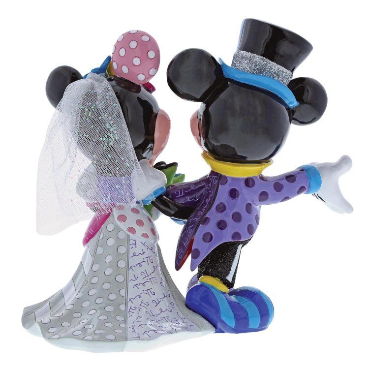 Trouwbeeldje van Mickey en Minnie Mouse, achterkant. Minnie in een witte jurk met stippen en een sluier. Mickey in een paarse jas en hoge hoed.