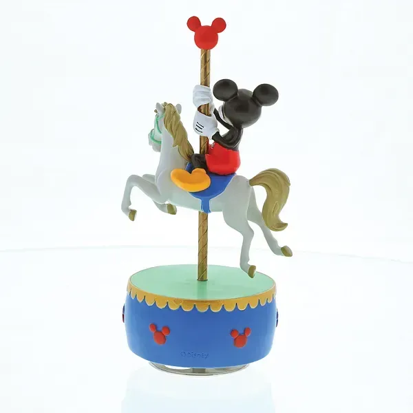 Mickey Mouse op een carrouselpaard bovenop een blauwgroene muziekdoos.