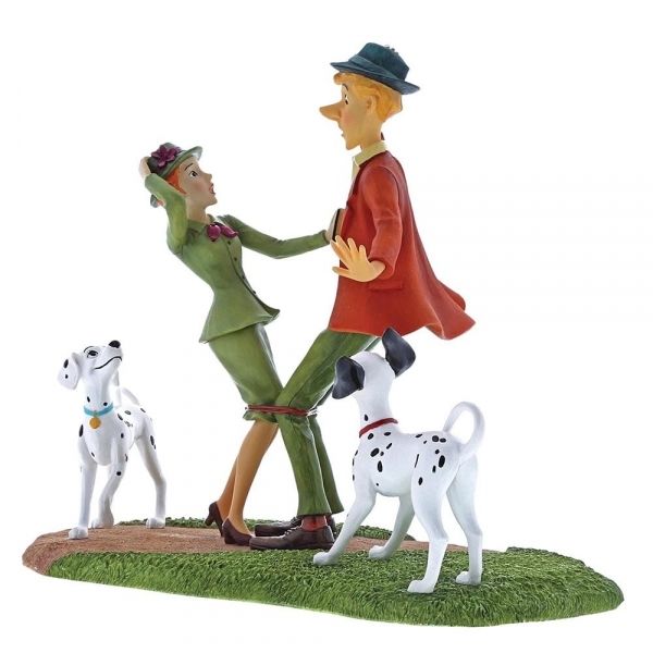 Beeldje van twee dansende mensen en twee dalmatiërs.