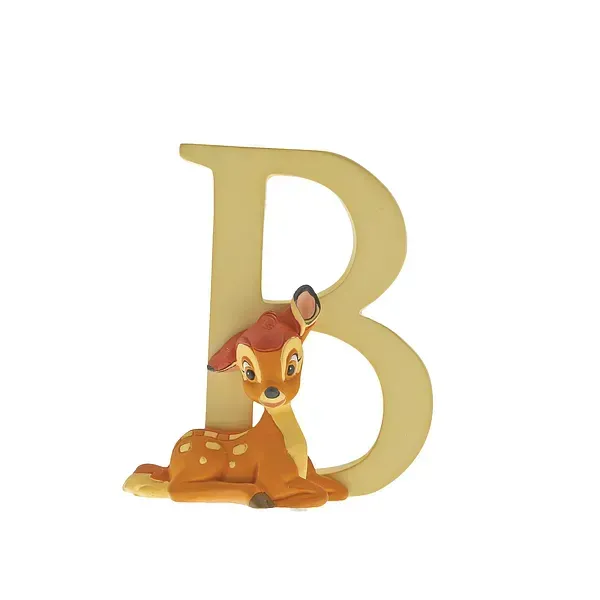 Een beeldje van Bambi naast een beige letter