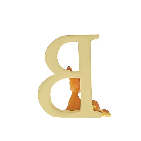 Een beeldje van Bambi naast een beige letter