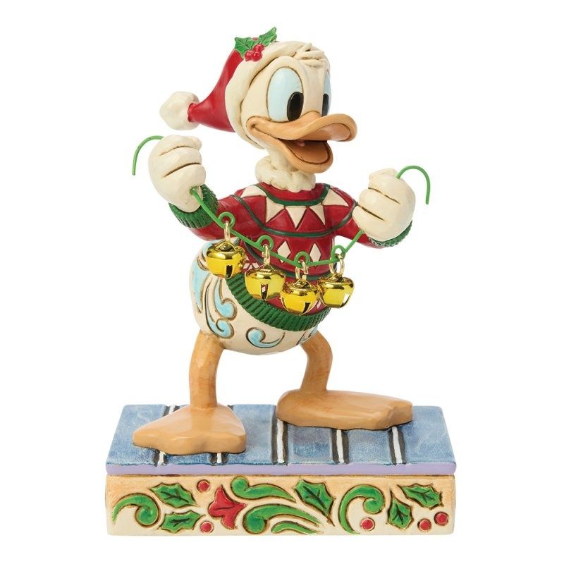 Festive Donald Duck figurine in a Santa hat, holding a holiday basket on a decorated base