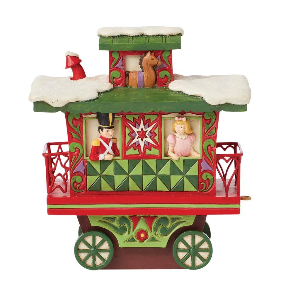 Een kerstkarretje met een notenkraker en een eekhoorn erop