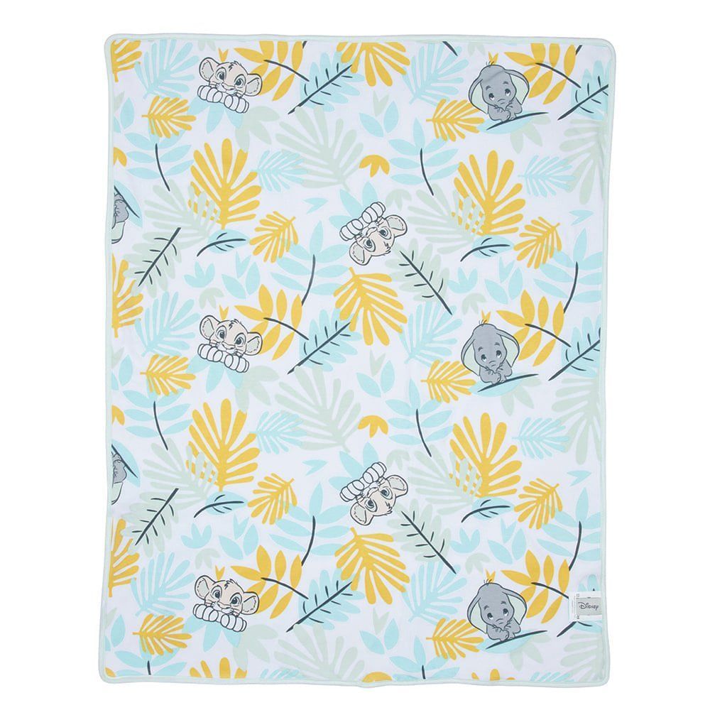Een deken met een patroon van koala's en bladeren erop.