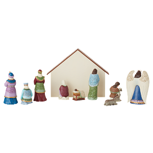 Een kerststal met een kribbe en beeldjes op een witte achtergrond.