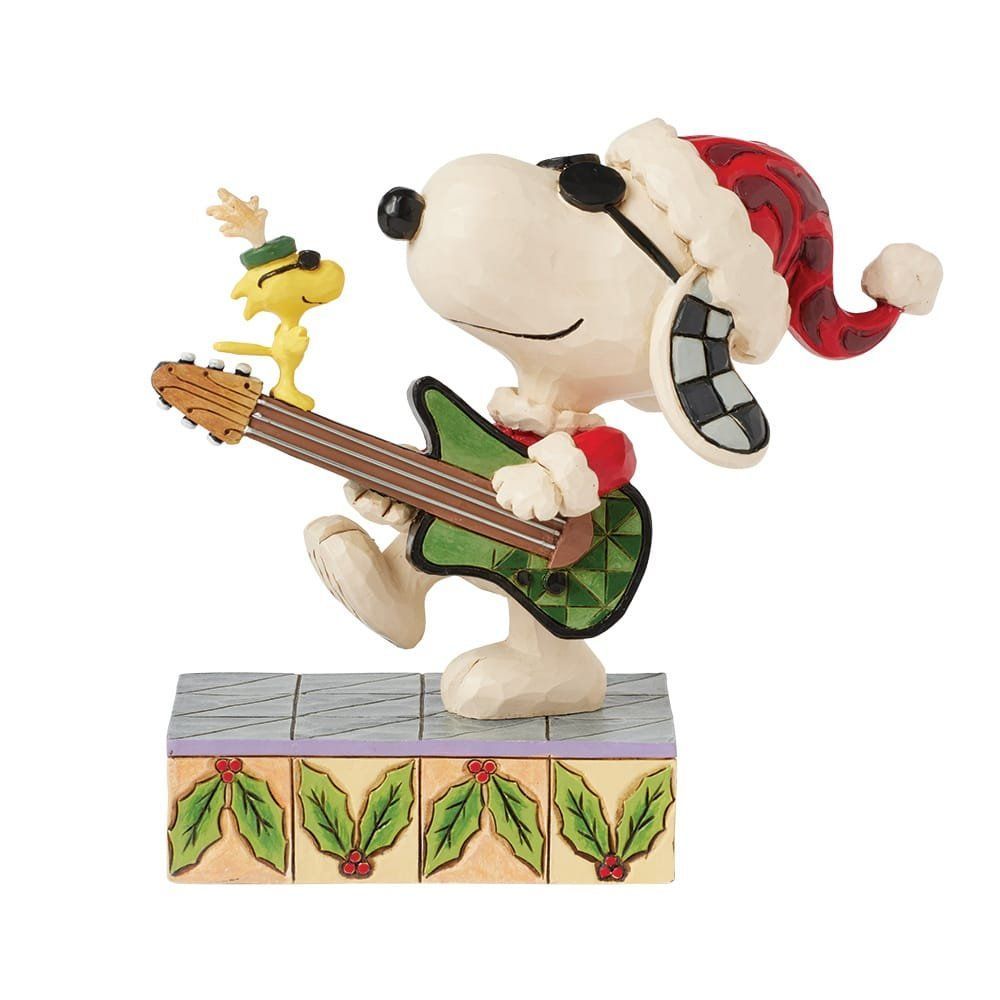 Een beeldje van Snoopy en Woodstock die gitaar spelen.