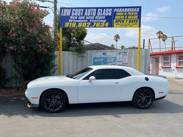 White Car Under a Tarpaulin — Sacramento, CA — Low Cost Auto Glass & Window Tinting