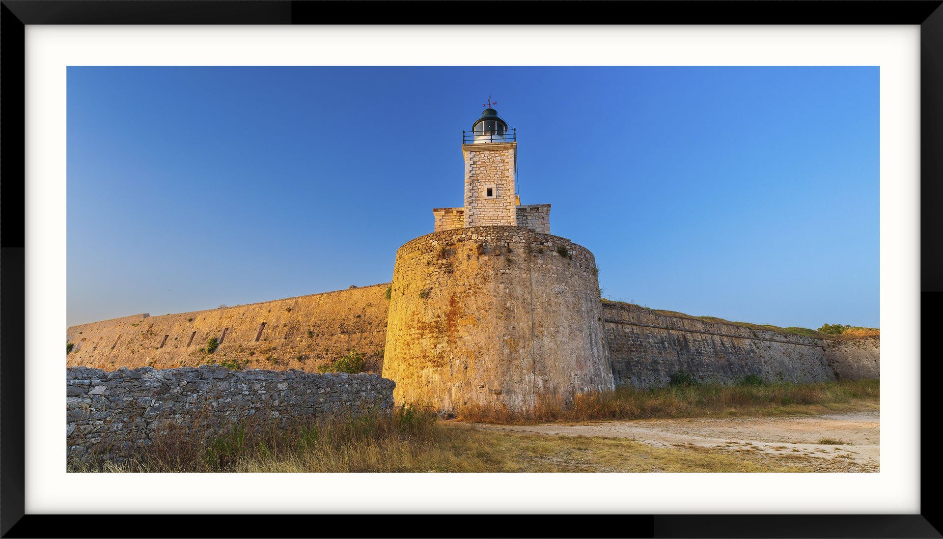 Lefkas Island - Entry a picture of a lighthouse on top of a stone wall castle