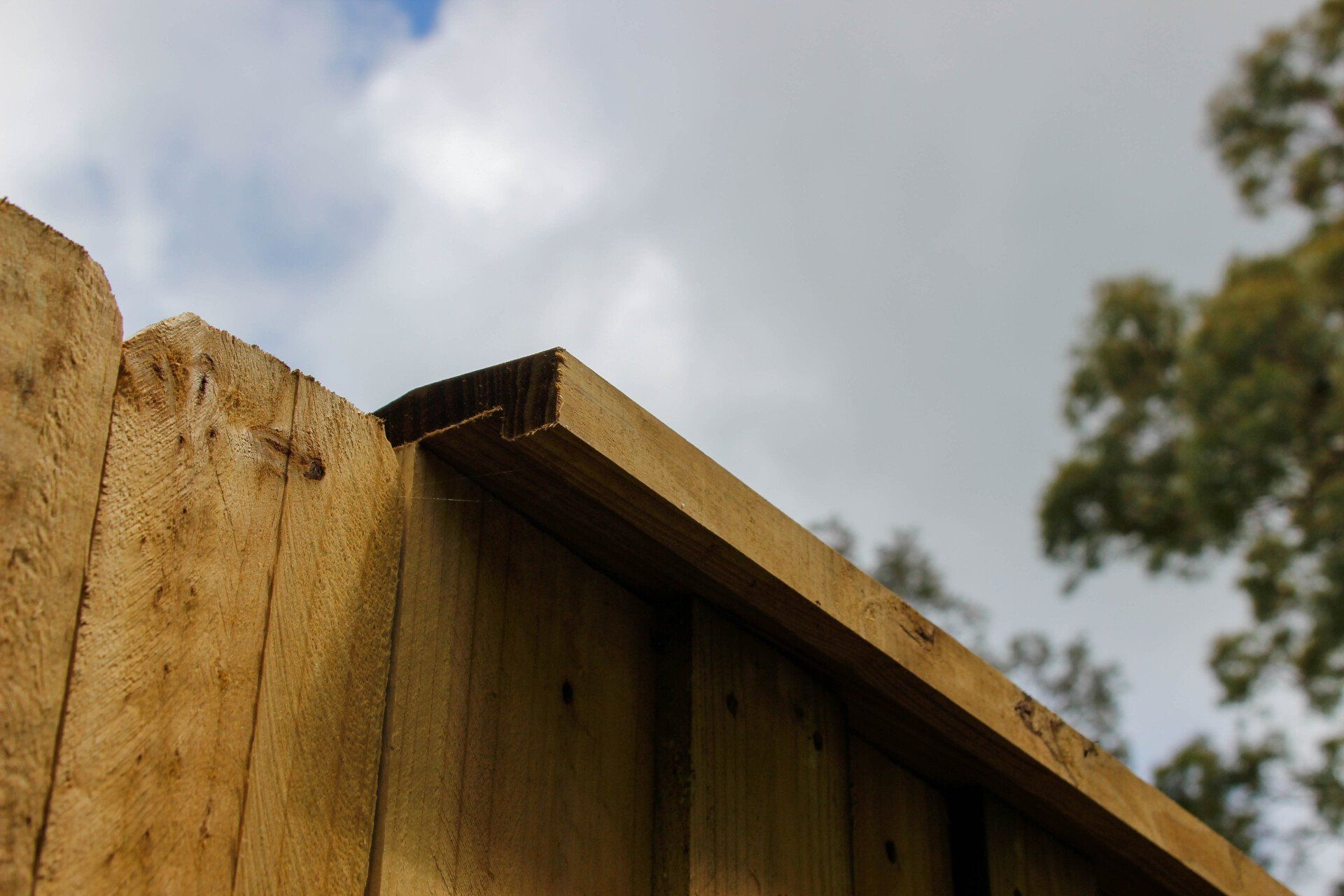 Closeup of Wooden Fence — Fences in Aylmerton, NSW