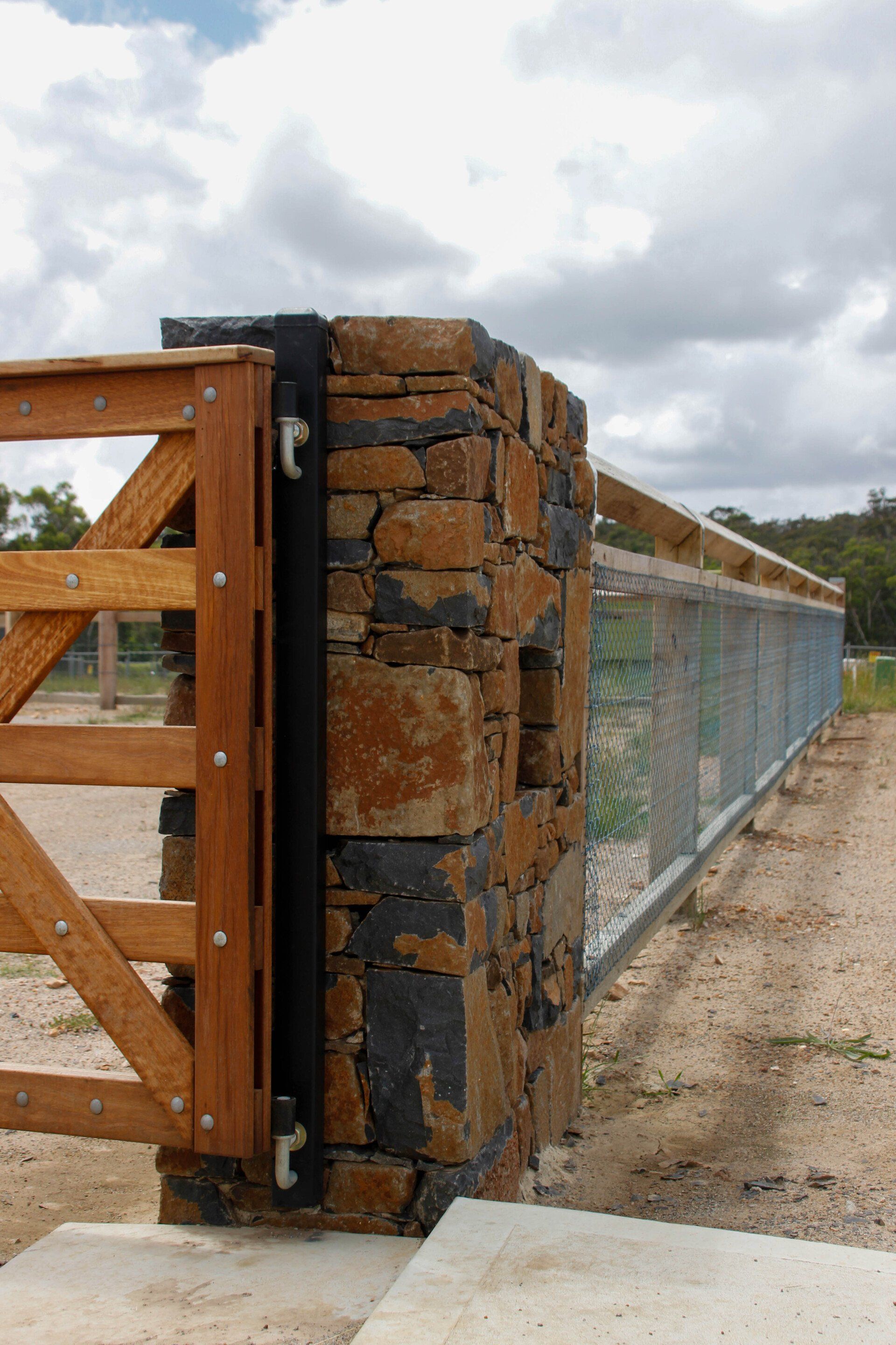 Custom Stone And Wood Fence — Fences in Aylmerton, NSW