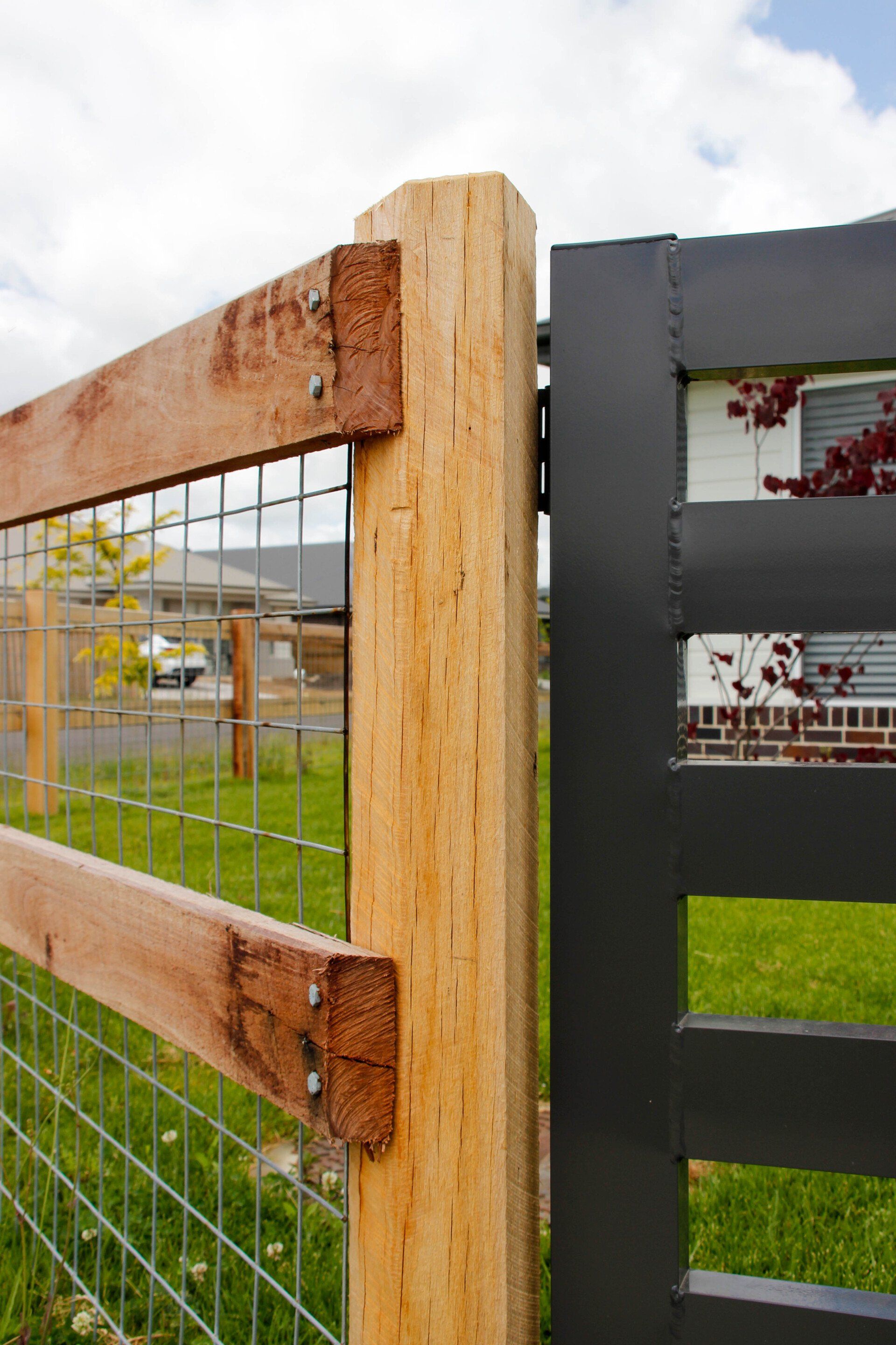 Custom Black Gate And Wooden Fence — Fences in Aylmerton, NSW