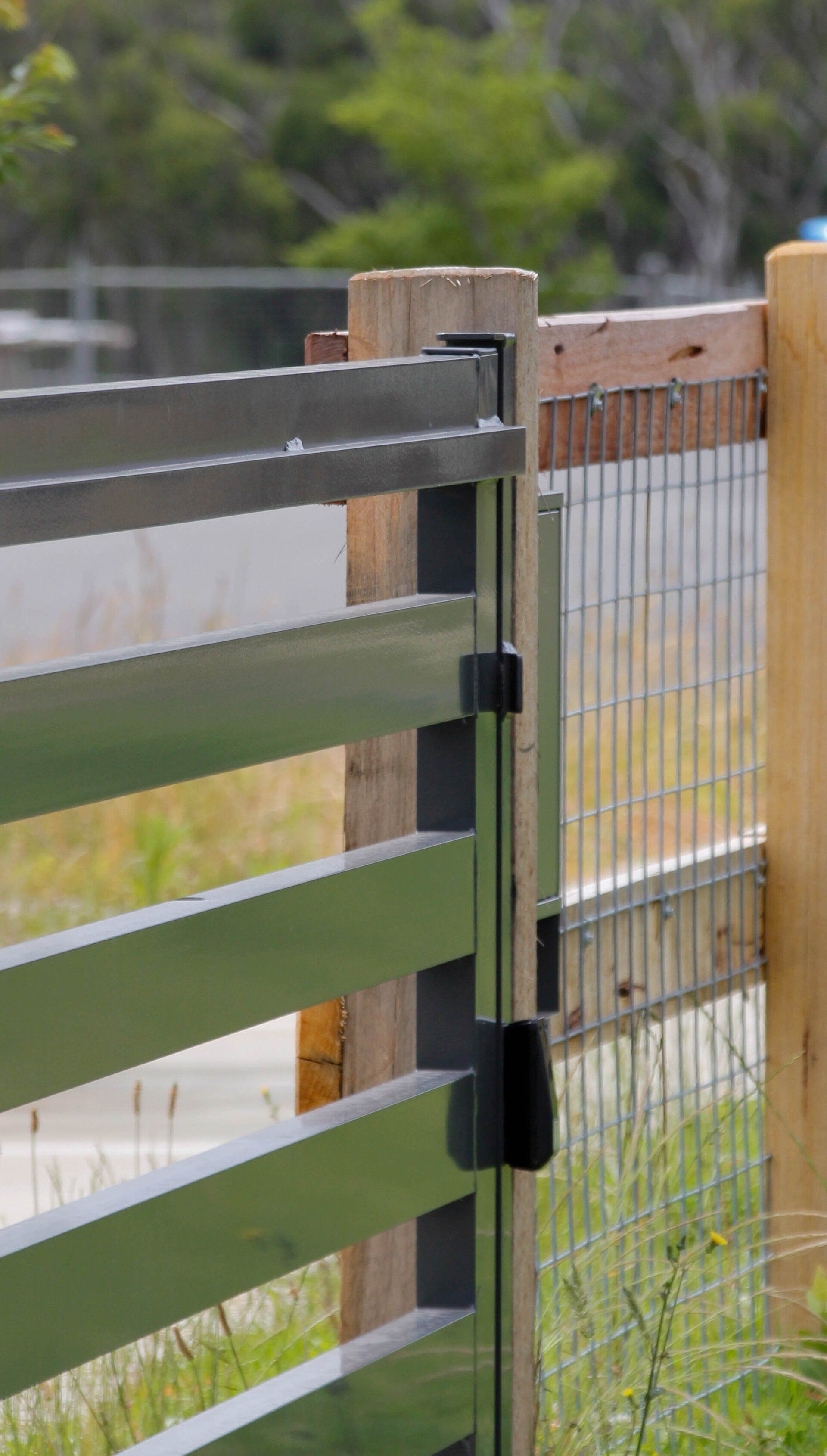 Black Gate With Aluminium And Wooden Fence — Fences in Aylmerton, NSW