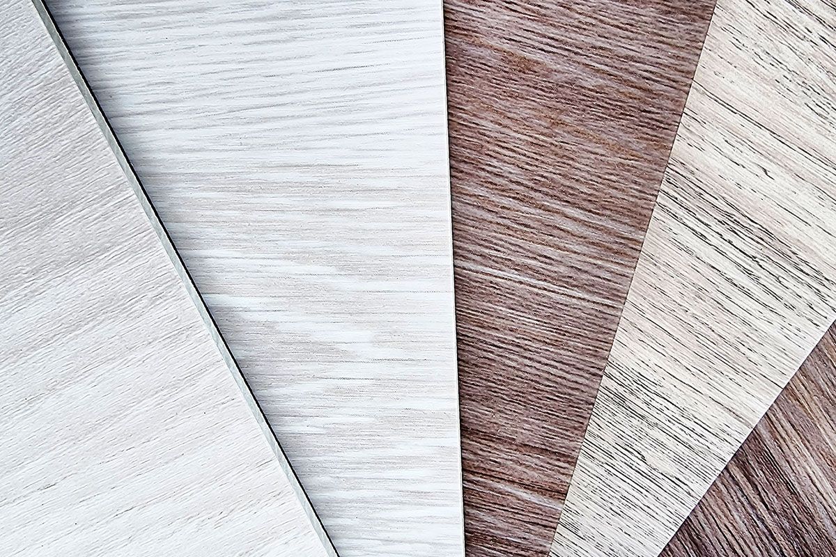 Samples of various wood grain textures, varying in shades of white and brown.