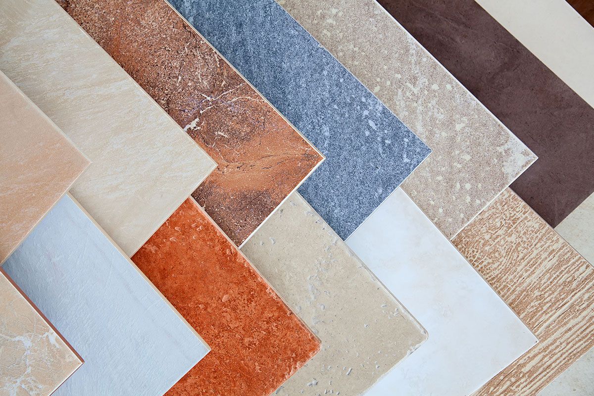 Variety of diagonally arranged ceramic tiles in various colors and textures.