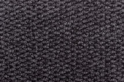 Close-up of dark gray woven fabric, with a textured, bumpy surface.