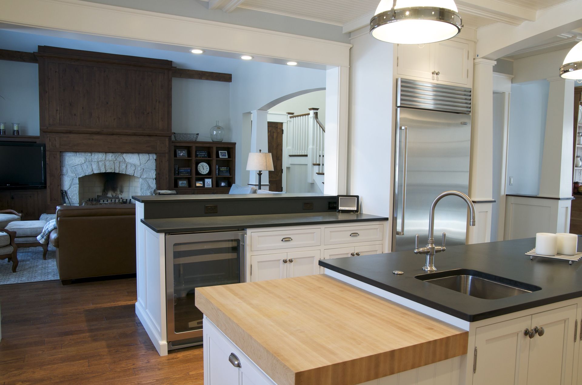 A kitchen with a large island and a sink