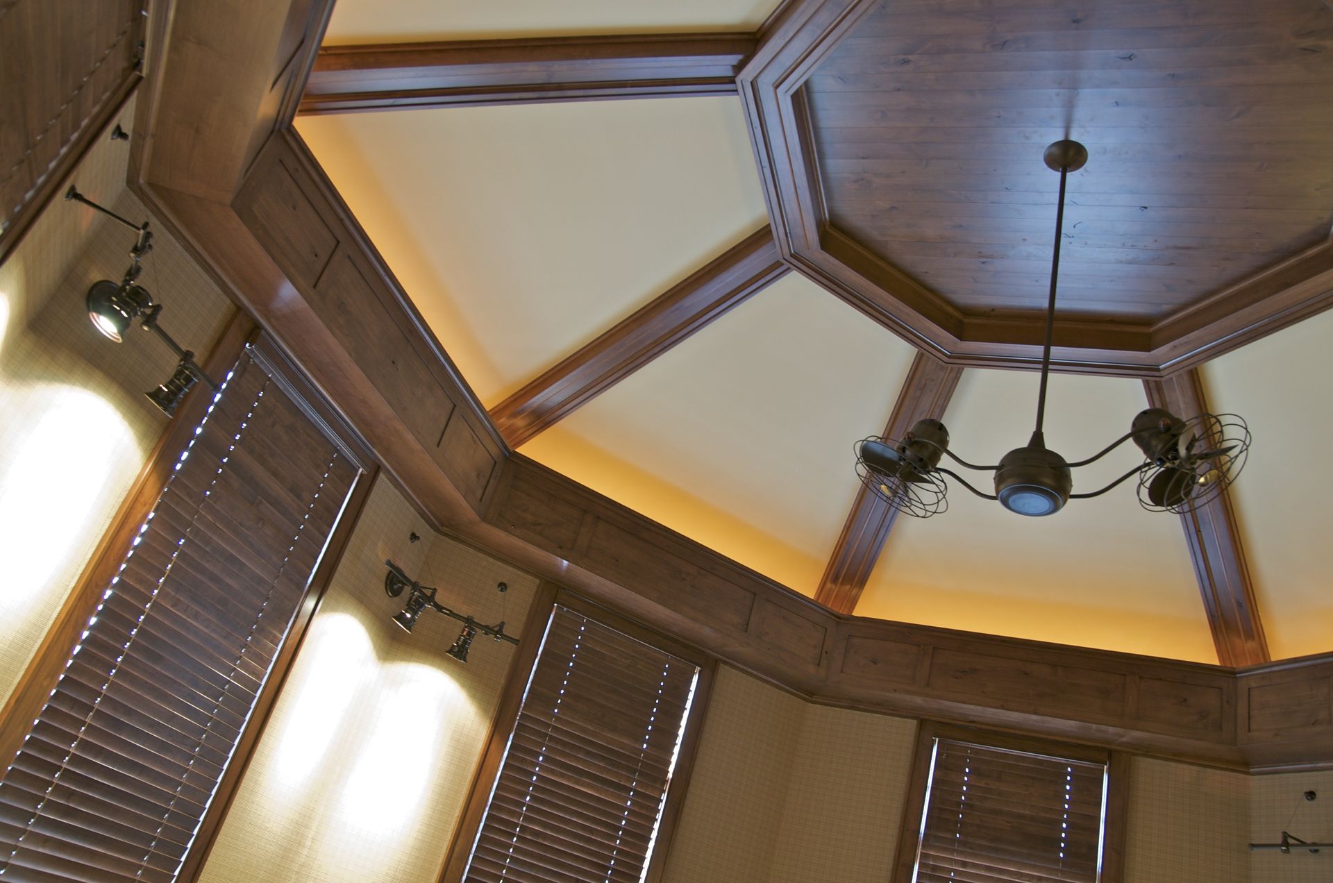 A room with a wooden ceiling and a chandelier