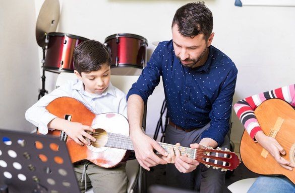 Music Teacher Teaching Guitar Lesson — Carmel, IN — Carmel Music Academy
