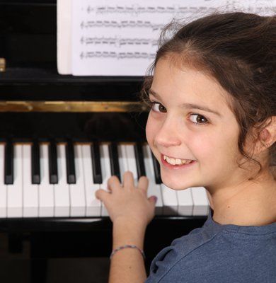 A Little Girl Playing Piano — Carmel, IN — Carmel Music Academy