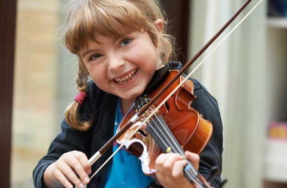 A Happy Kid Playing Violin — Carmel, IN — Carmel Music Academy