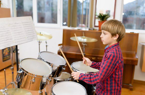 A Kid Playing Drums — Carmel, IN — Carmel Music Academy