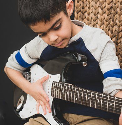 Boy Practicing the Electric Guitar — Carmel, IN — Carmel Music Academy