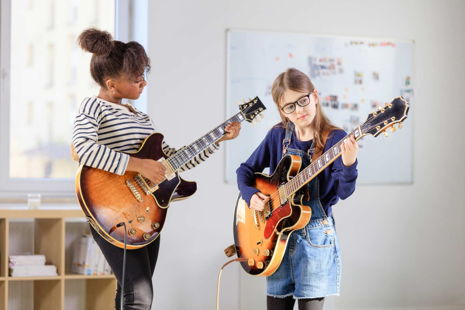 Female Student Learning Guitar — Carmel, IN — Carmel Music Academy