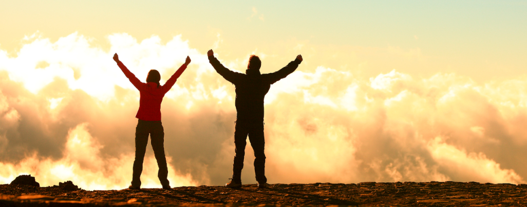 Man and woman achieving goals