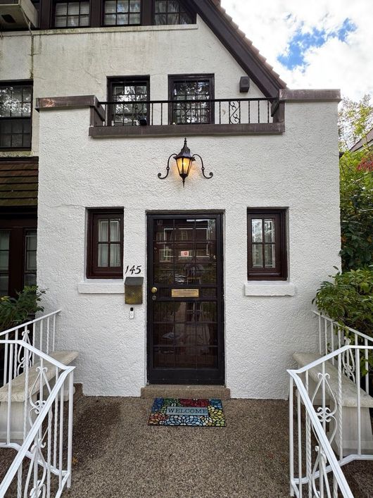 Residential exterior house painting with freshly renovated facade in NYC