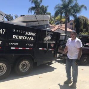 Man standing next to a black 