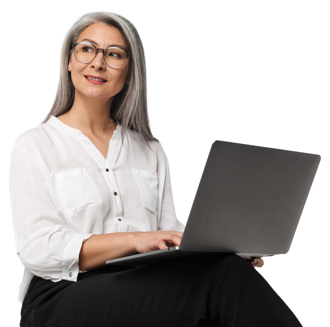 Image of adult mature woman wearing eyeglasses and office clothes using laptop computer isolated