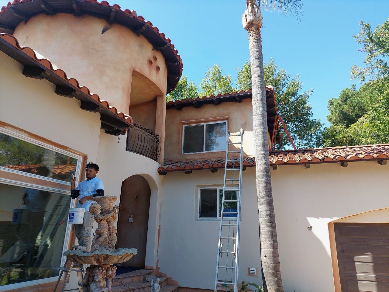 stucco home tile roof gutters