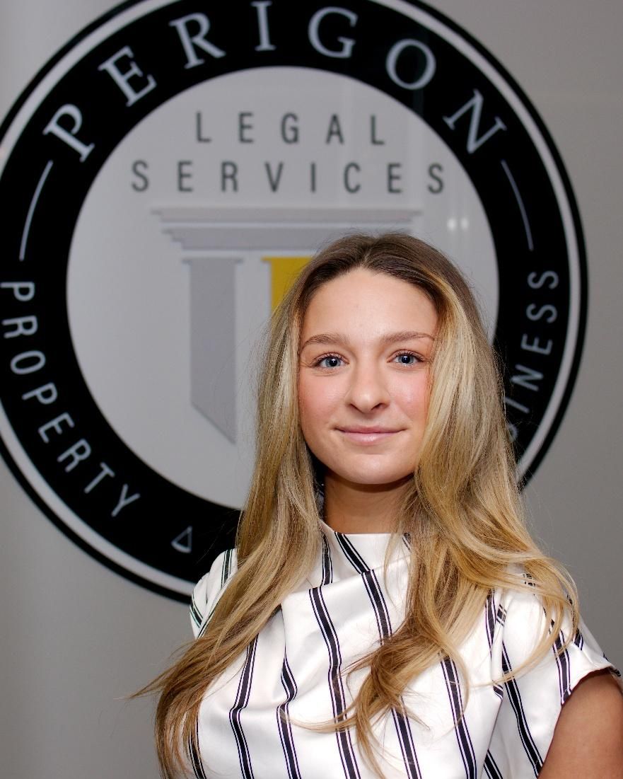 Woman standing in front of a Legal Services logo and sign