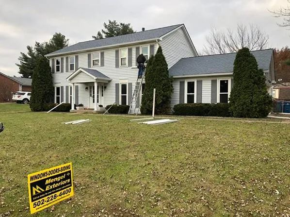 Installing window shutter — Prospect, KY — Mengel Exteriors