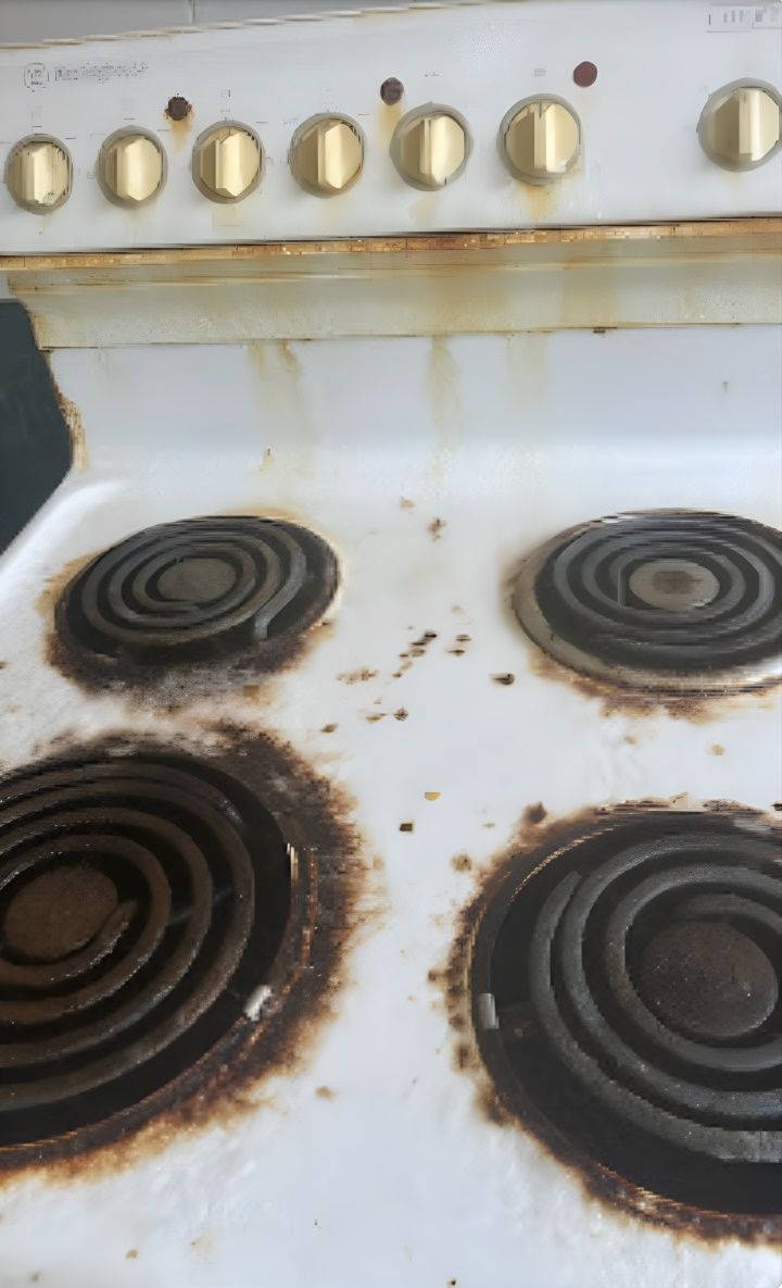 A Dirty Stove Top With a Lot of Rust on It — Lease Clean Newcastle in Newcastle, NSW