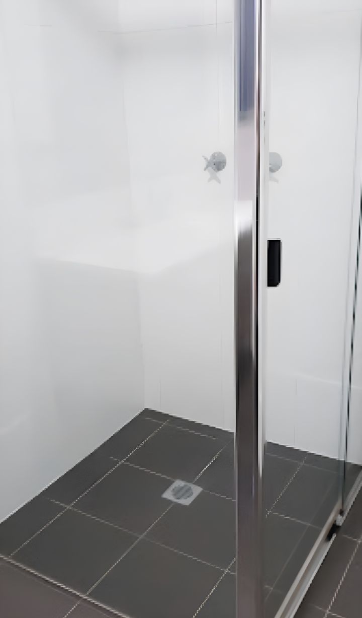 A Bathroom With a Shower and a Tiled Floor — Lease Clean Newcastle in Newcastle, NSW