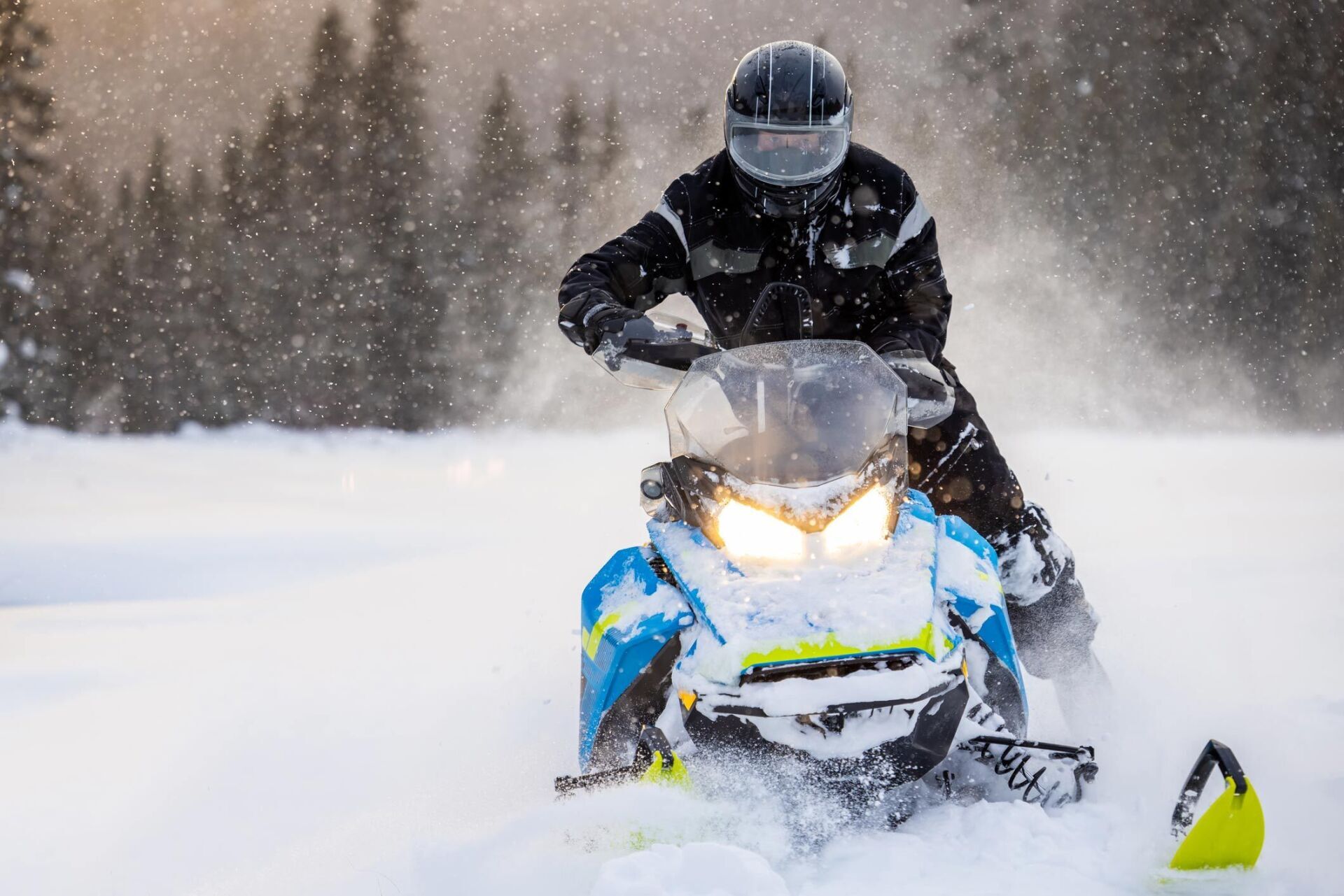 Man Having Fun Speeding With A Snowmobile — Flagstaff, AZ — Evans Insurance Inc.