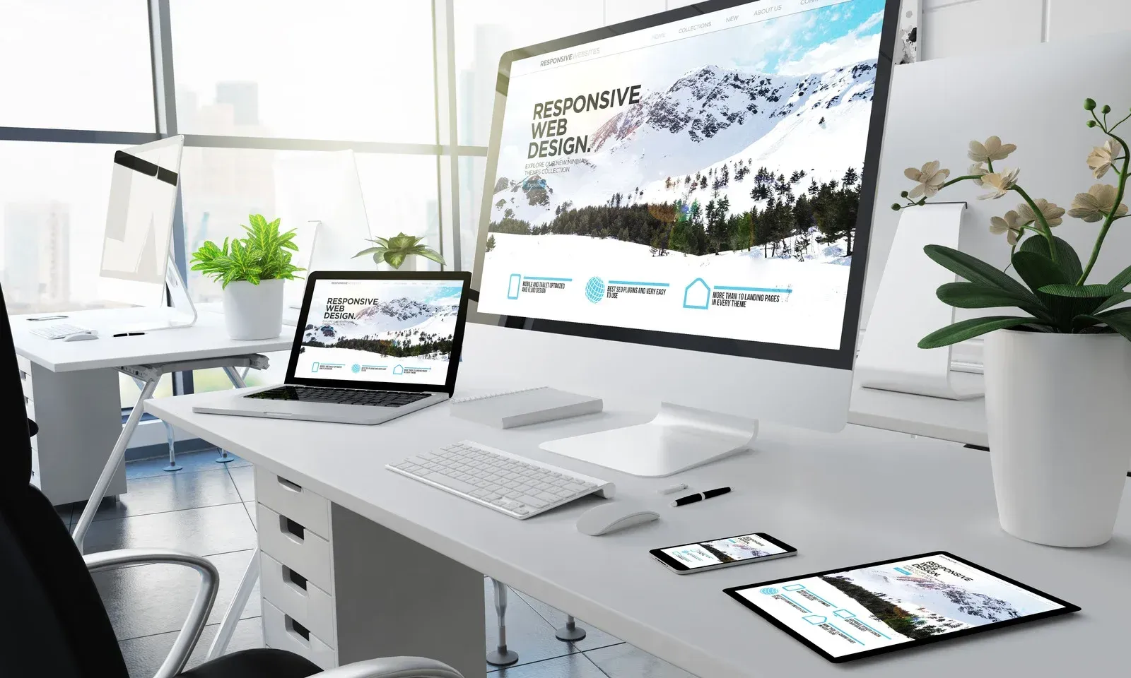 A desk with a computer , laptop , and tablet on it.