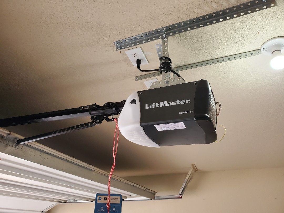LiftMaster garage door opener mounted on garage ceiling.