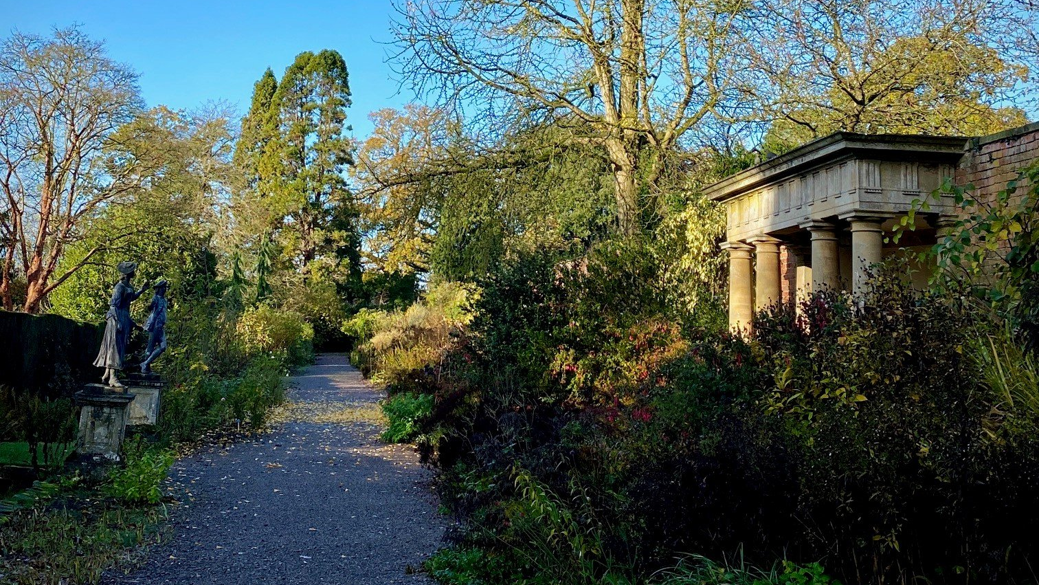 There is a statue of an eagle in the middle of the park.