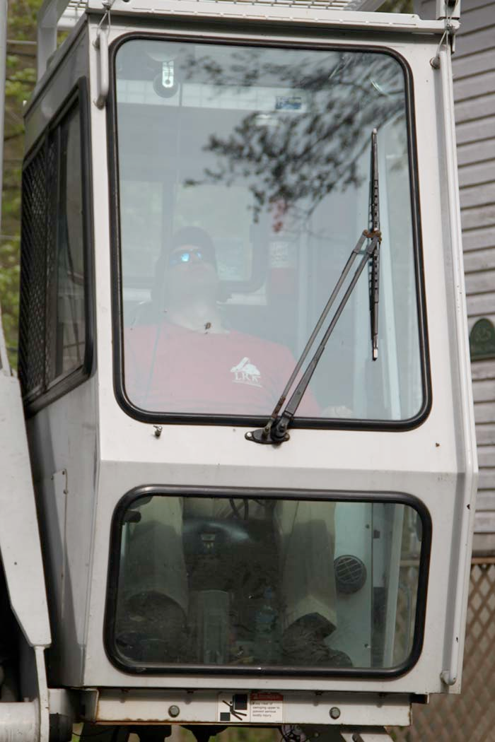 A red and white vehicle with the number 8 on the windshield