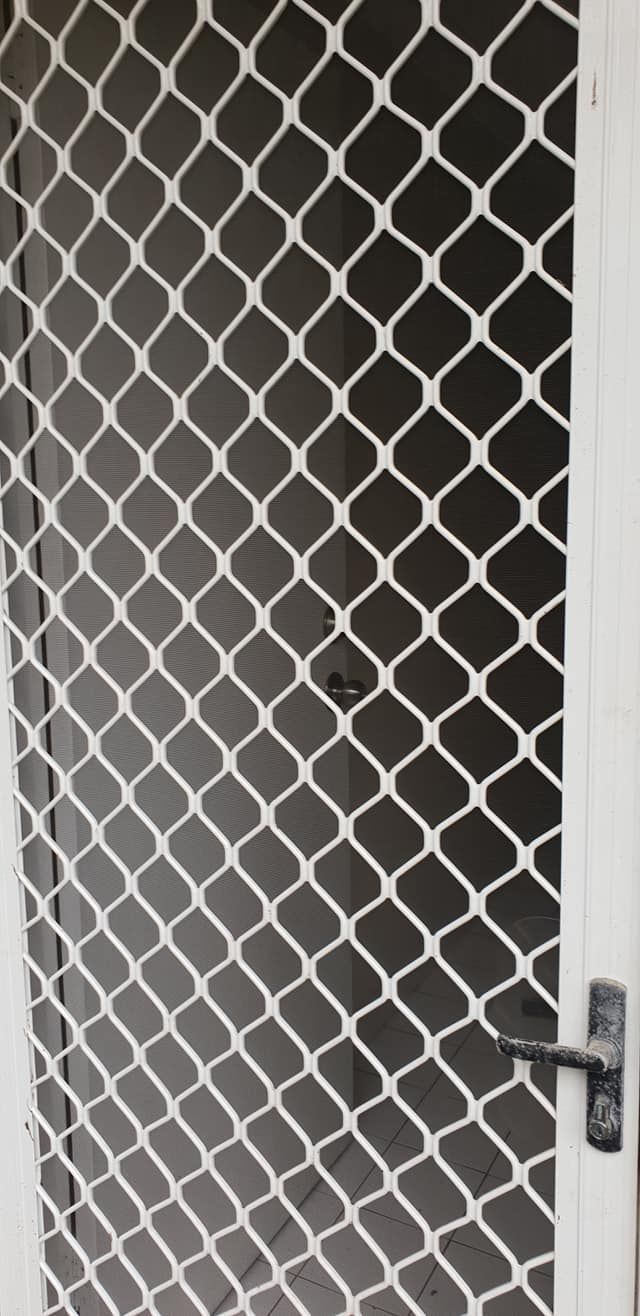 A White Door With a Screen on It — North Coast Screens & Repairs in Alstonville, NSW