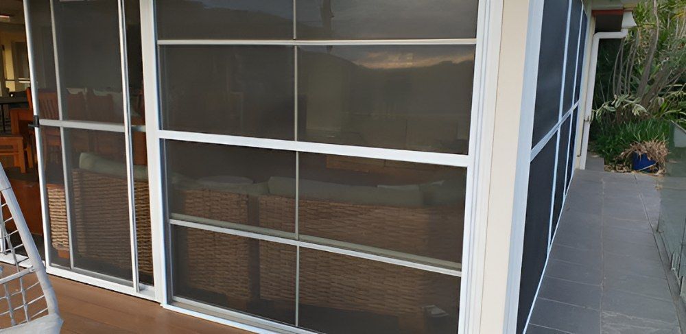 A Screened in Porch With Sliding Glass Doors — North Coast Screens & Repairs in Lennox Head, NSW