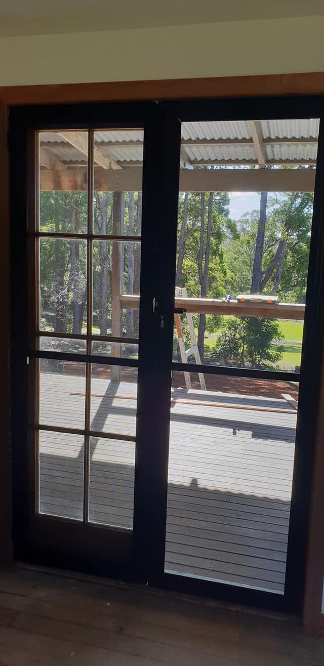 A Pair of Sliding Screen Doors Leading to a Deck — North Coast Screens & Repairs in Lennox Head, NSW