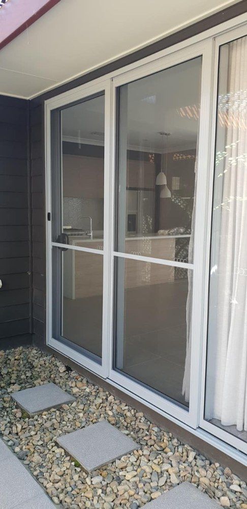 A White Security Door — North Coast Screens & Repairs in East Ballina, NSW