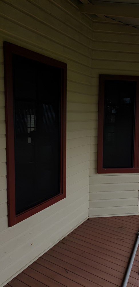 There are Two Screened in Windows on the Side of a House — North Coast Screens & Repairs in Goonellabah, NSW
