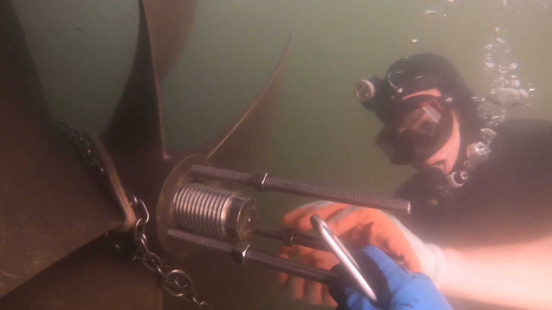 Man Repairing the Boat Underwater — Palm Harbor, FL — Ozona Dive Service
